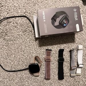 Fitbit Versa 4 with Black, Pink, and White Bands